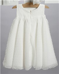 2702-2 Εκρού φόρεμα από κεντητή μουσελίνα στολισμένο με γκοφρέ λουλούδι και κορδελάκια.
